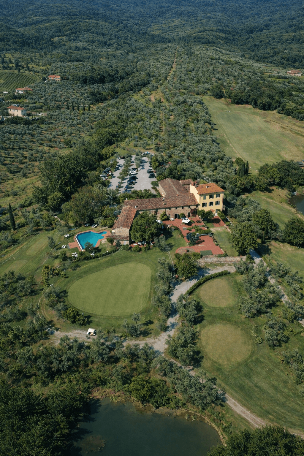 Wine tasting experience at local Tuscan vineyard with glasses of red wine and scenic views